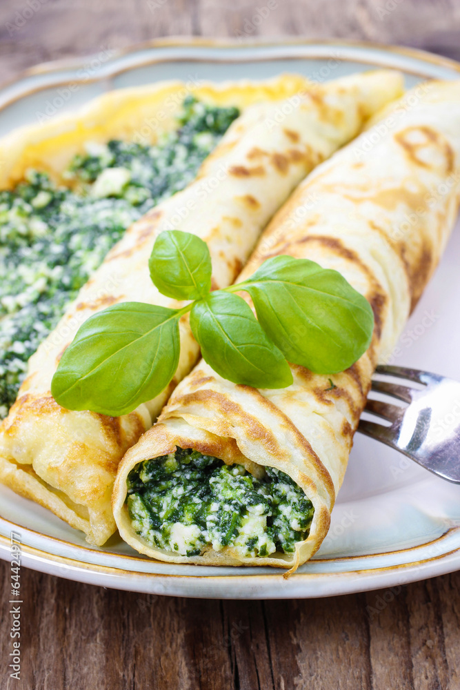 Wall mural Mediterranean cuisine: crepes stuffed with cheese and spinach