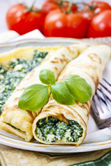 Mediterranean cuisine: crepes stuffed with cheese and spinach