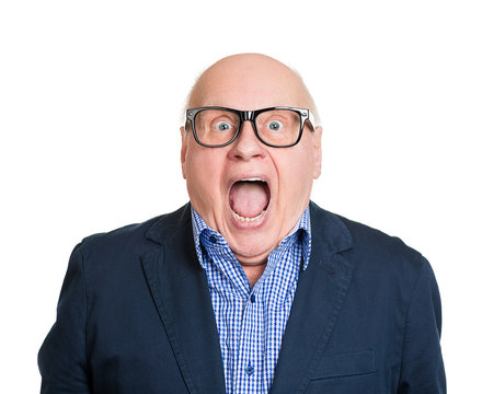 Shocked old man, with wide open eyes and mouth on white