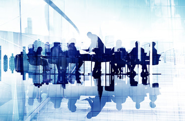 Business People's Silhouettes in a Meeting