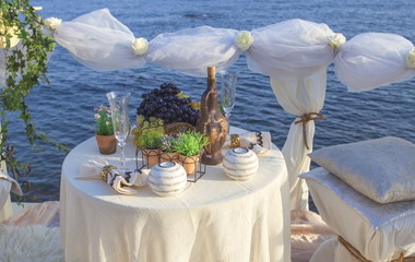 Table setting on the sea shore.