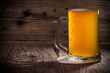 glass beer on wood background