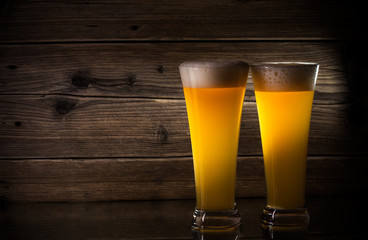 glass beer on wood background