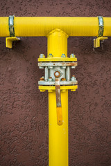 yellow gas pipe with a crane and gear