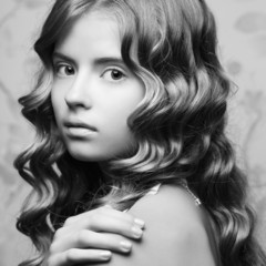 Monochrome portrait of a teen girl with glossy hair