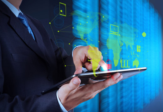 businessman hand using tablet computer and server room backgroun
