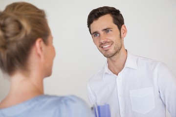 Casual business people looking at each other