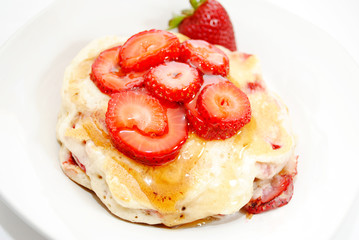 Sliced Strawberries on Top of Fresh Hotcakes