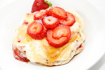 Fresh Sliced Berries on Top of Hotcakes