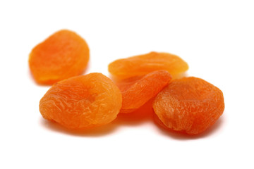 Dried apricots on a white background with a light shadow