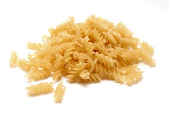 Raw Italian pasta made ​​from durum wheat on a white background