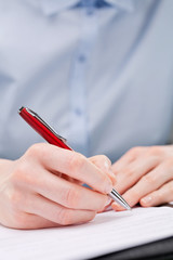 Business Hand Writing or Signing a Document