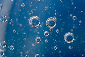 Air bubbles . Background blue. Macro