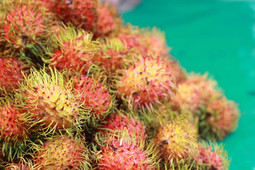 Sweet fruits rambutan in the market