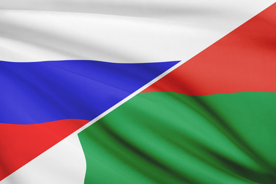 Series of ruffled flags. Russia and Republic of Madagascar.