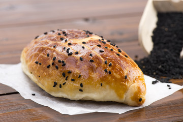 Turkish pastry with black cumin seeds called pogaca