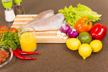 brotola raw fish with fresh vegetables