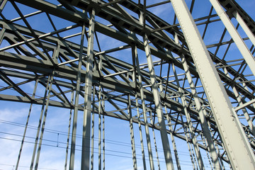 Construction of a railway bridge against sky in sunlight