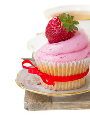 cupcake with strawberry on white