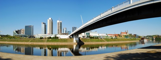 The Vilnius city walking bridge with skyscrapers