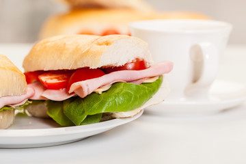Panini sandwich with ham, cheese and tomato