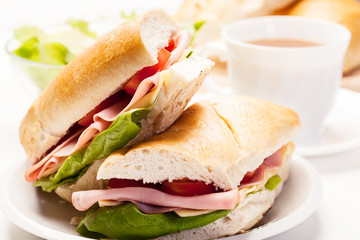 Panini sandwich with ham, cheese and tomato