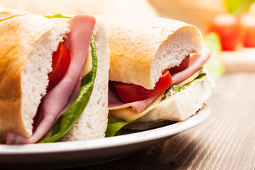Panini sandwich with ham, cheese and tomato