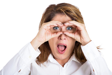 Shocked. Portrait surprised woman looking through binoculars