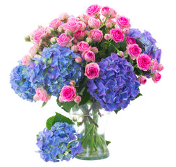 posy of pink roses and blue hortensia flowers close up