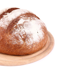 Rye bread on wooden stand isolated on white