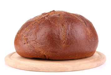Rye bread on wooden stand isolated on white