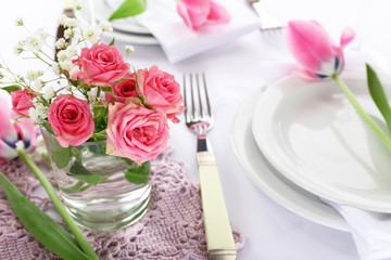 Table setting with spring flowers close up