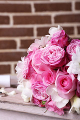 Beautiful wedding bouquet on bricks wall background