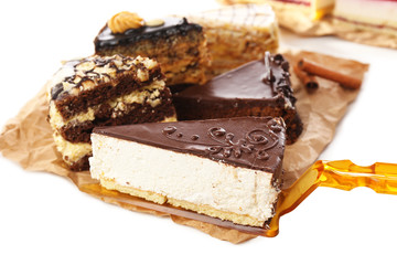 Assortment of pieces of cake, isolated on white © Africa Studio