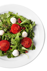 Green salad made with  arugula, tomatoes, cheese mozzarella