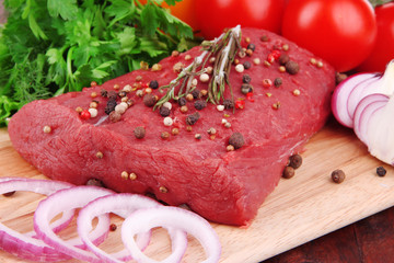 Raw beef meat with vegetables