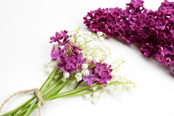 Beautiful lilac flowers and lilies of the valley, isolated