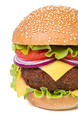 hamburger with meat, cheese and vegetables isolated on white