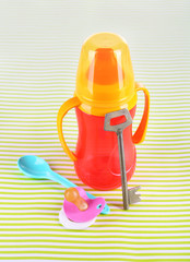 Obraz premium Composition with key, bottle for feeding baby and other