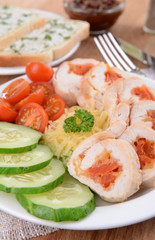 Delicious chicken roll on plate on table close-up