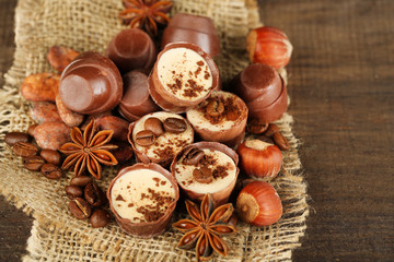 Tasty chocolate candies with coffee beans and nuts