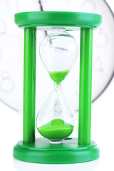 Hourglass on big clock  background