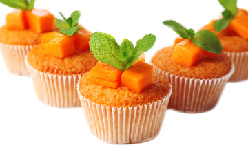 Tasty pumpkin muffins, isolated on white