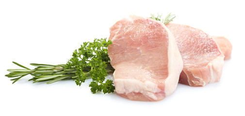 Raw meat steak with herbs isolated on white