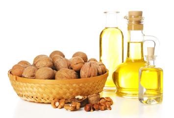 Walnut oil and nuts, isolated on white