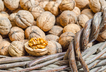 Cracked walnut in wicker basket