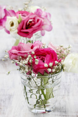 Tiny bouquets in glass vases. Wedding floral decorations