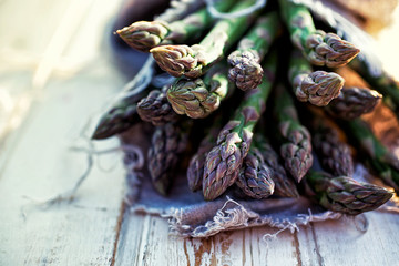 Bunch of fresh asparagus on wooden table