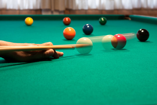 Shooting pool at a bar - Close-up shot of a man playing billiard