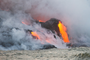 Red hot lava flowing into Pacific Ocean on Big Island, Hawaii